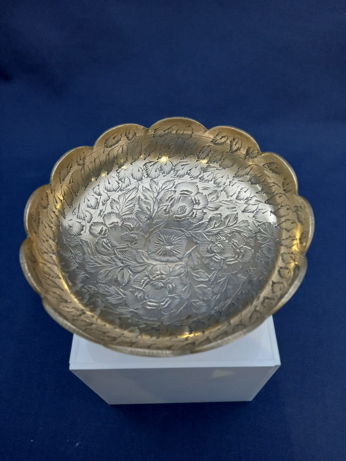 A small Indian brass dish with hand Embossed Floral Patterns and ...